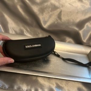 Dolce and Gabbana eyeglass case with strap.